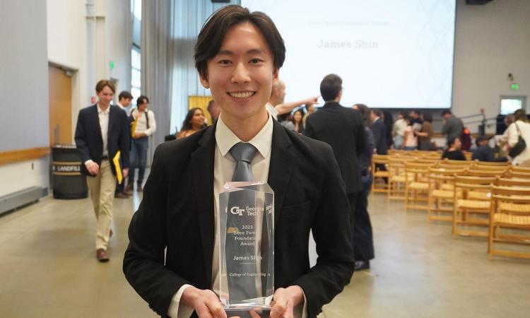 James Shine holding the Love Family Foundation Award after the Student Honors celeration. (Photo: Emily Creager)