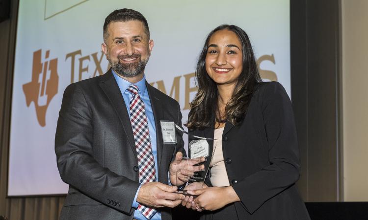 Sriya Surapaneni holds the Helen Grenga Award with BME's Essy Behravesh.