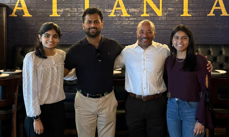 The three members of the winning team in the FAIR Tech competition with Dean Raheem Beyah, who treated them to lunch to learn more about their idea.