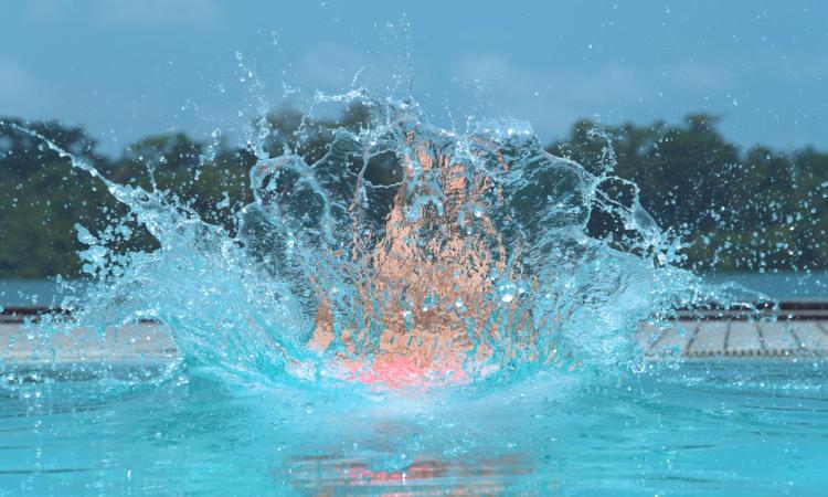 a person making a splash in the pool