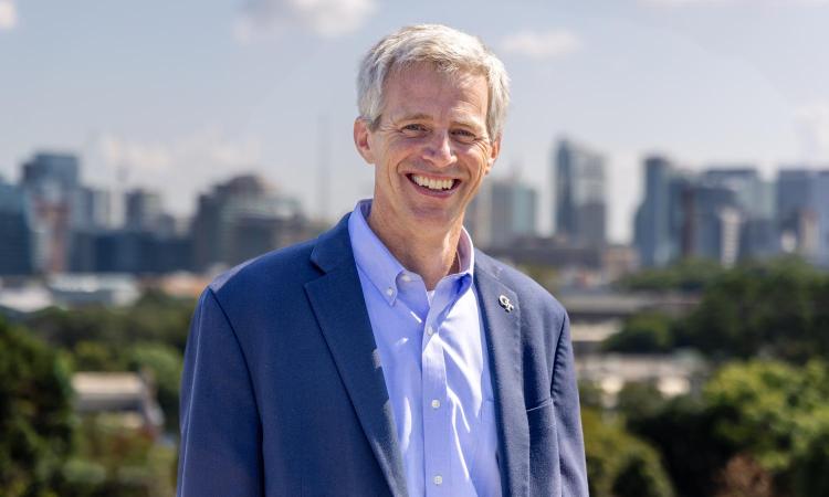Tim Lieuwen in front of Atlanta skyline