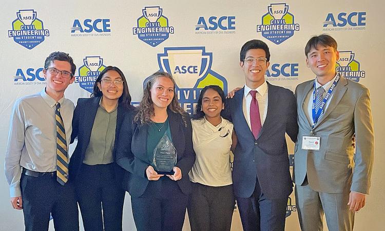 Six members of the first-place Sustainable Solutions team from Georgia Tech with their award trophy.