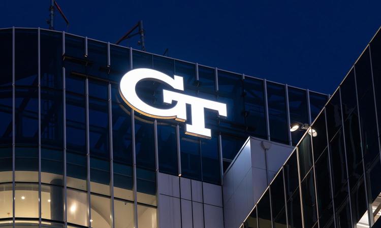 Illuminated Georgia Tech logo atop the Coda building.