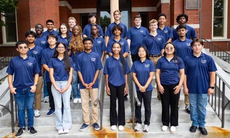 group of people standing on stairs