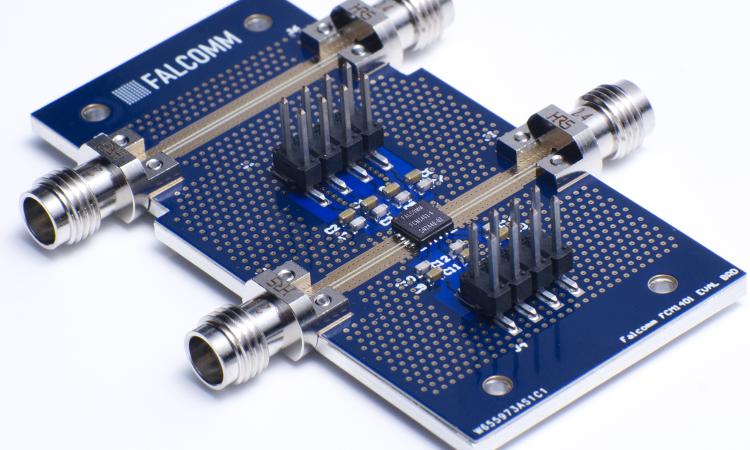 A power amplifier chip connected to an evaluation board for performance tests.