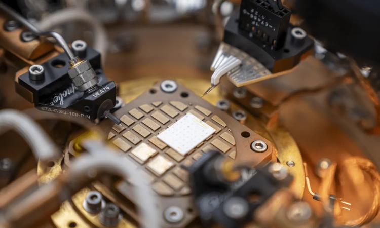 Small sensors arrayed around a round plate inside a cryogenic testing system.