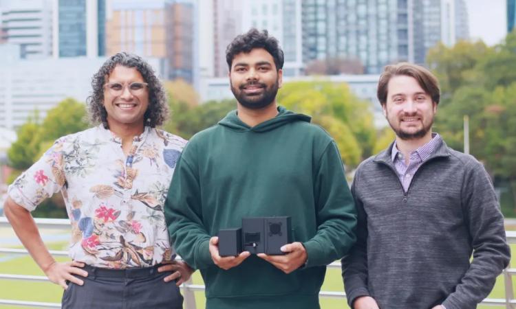 Skopii's three founders and their small, portable device.