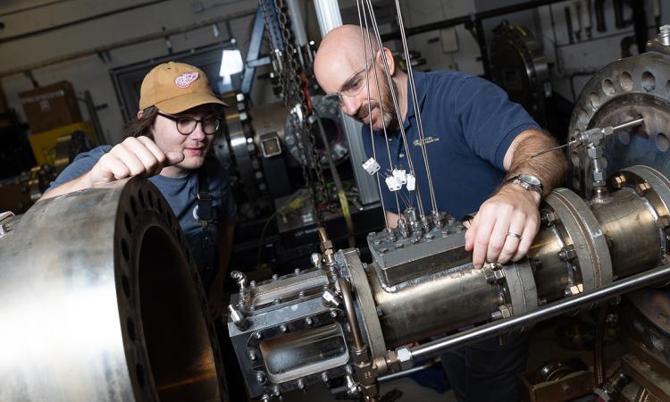 two people work in a combustion lab