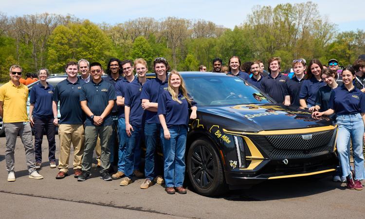 The Georgia Tech EcoCAR team poses with their vehicle at the final competition.