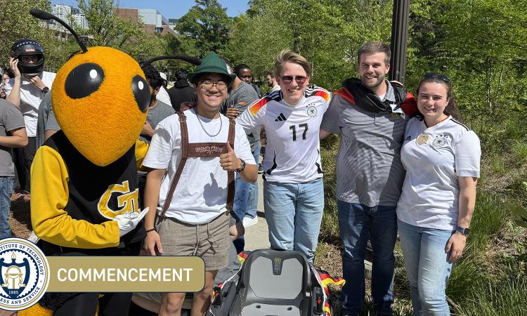 Lucas McCarty and friends pose with Buzz during race day for their EV and the Grid course.