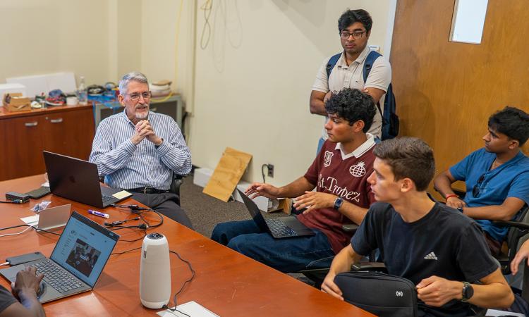 Ed Coyle with students on his Smart Stadium VIP team, a project that uses sports and entertainment venues as living laboratories for technology research.