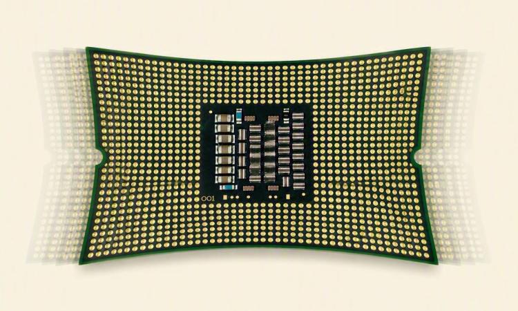 Illustration of a realistic looking computer chip being pulled in four directions and vibrating.