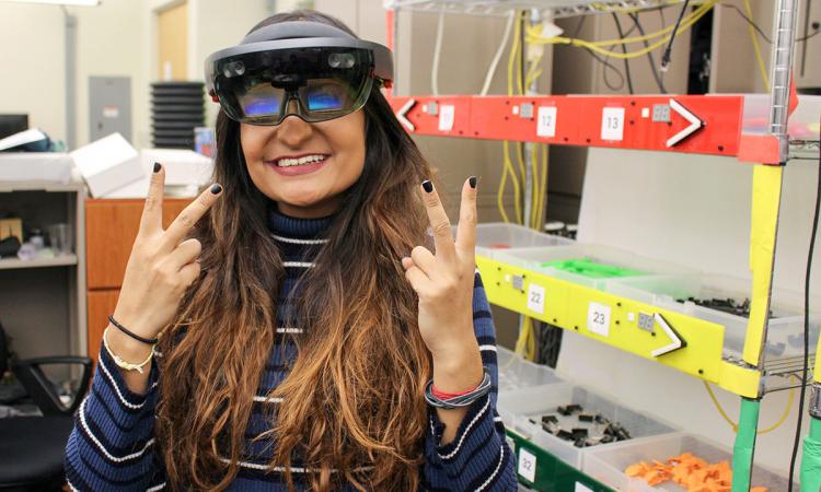 Charu Thomas wearing Oculogx AR glasses