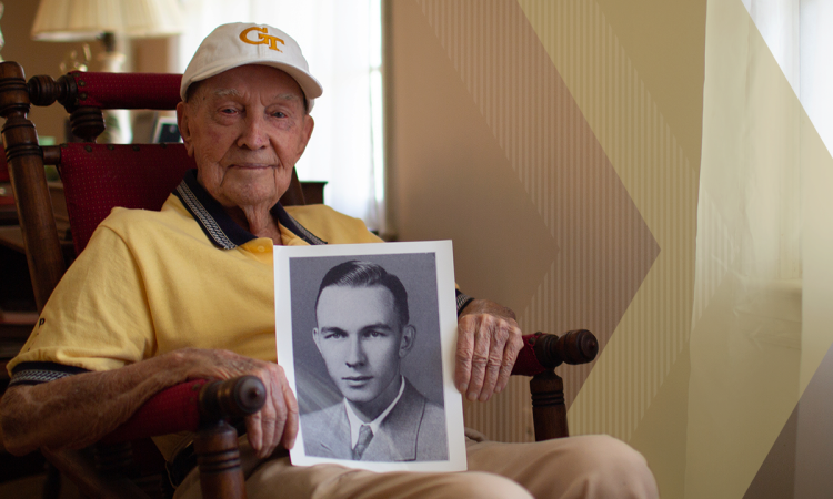 Roy Bethune in his rocking chair holding his old portrait