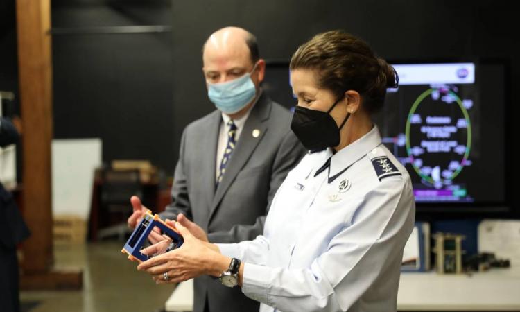 Lt. General Nina Armagno holds a cubesat