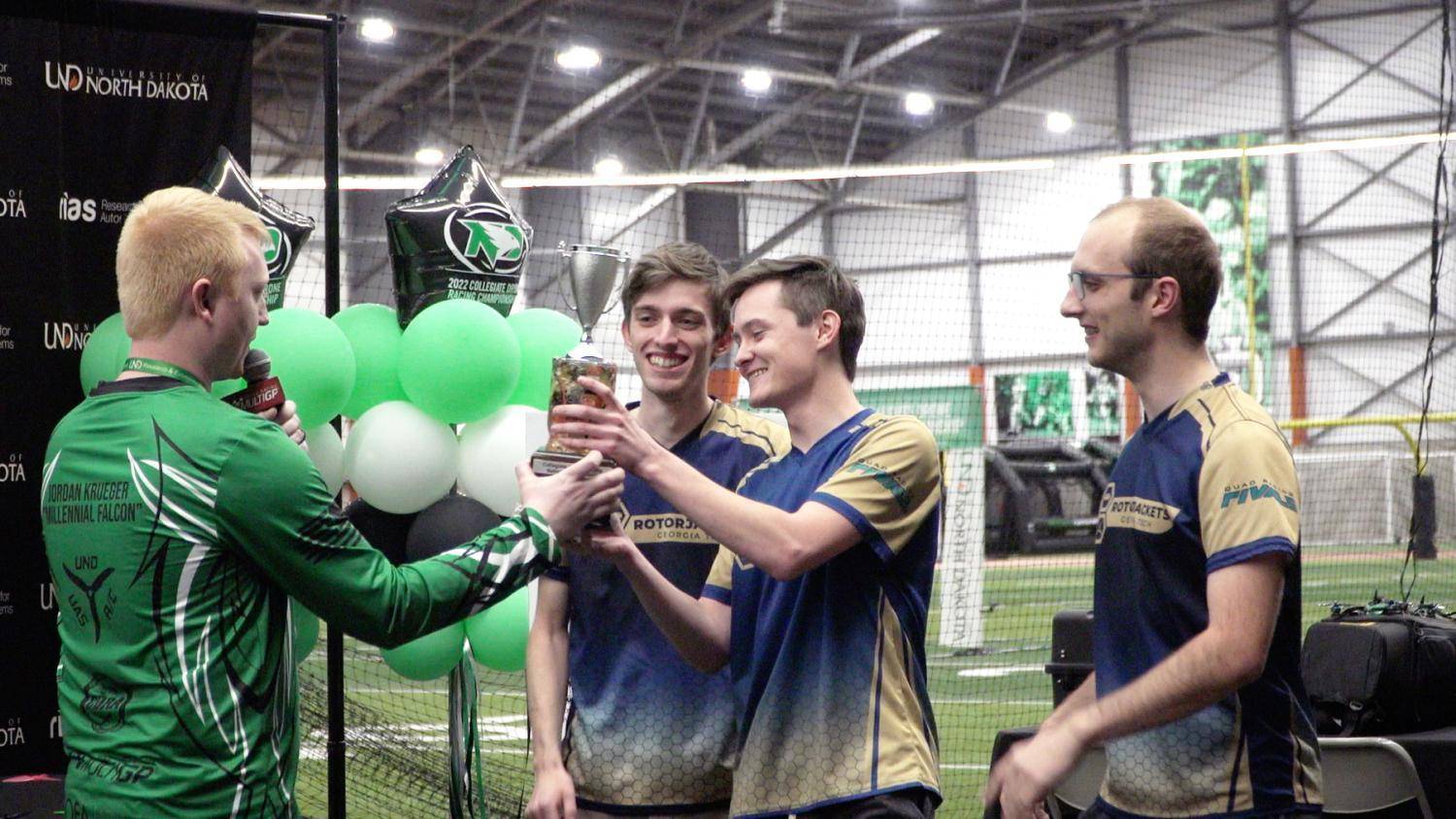 students accepting trophy