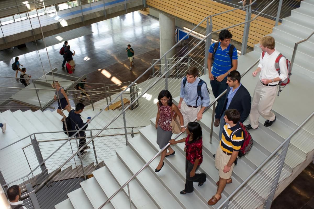 Students descending a staircase.