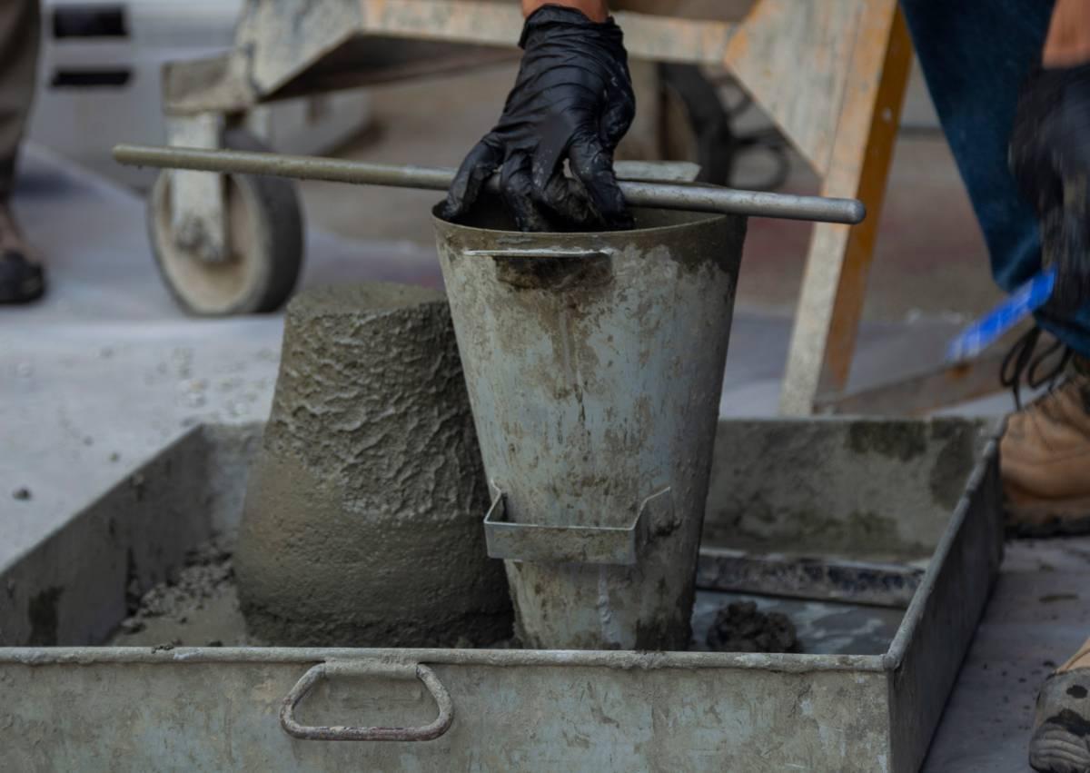 Senior civil engineering students mix, test, and cast concrete cylinders as part of a concrete mixing lab taught by Professor of the Practice Fred Meyer.