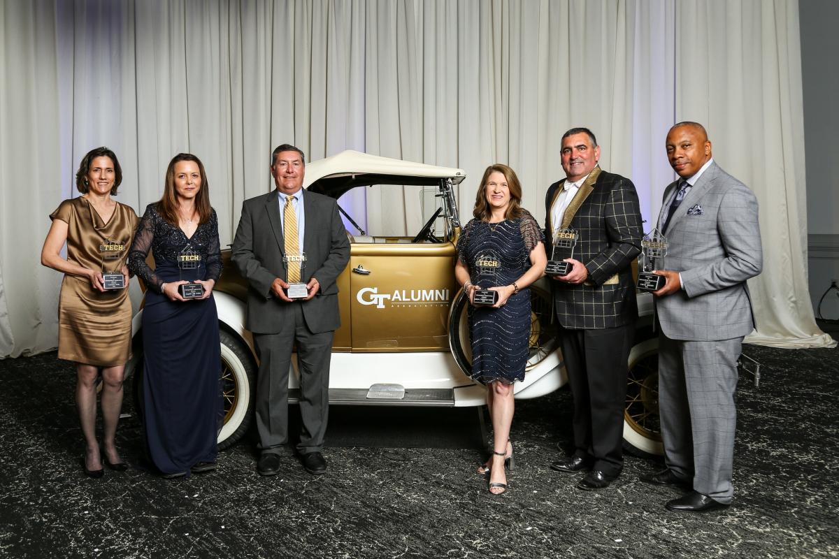 6 winners of 2022 awards standing next to Ramblin' Wreck