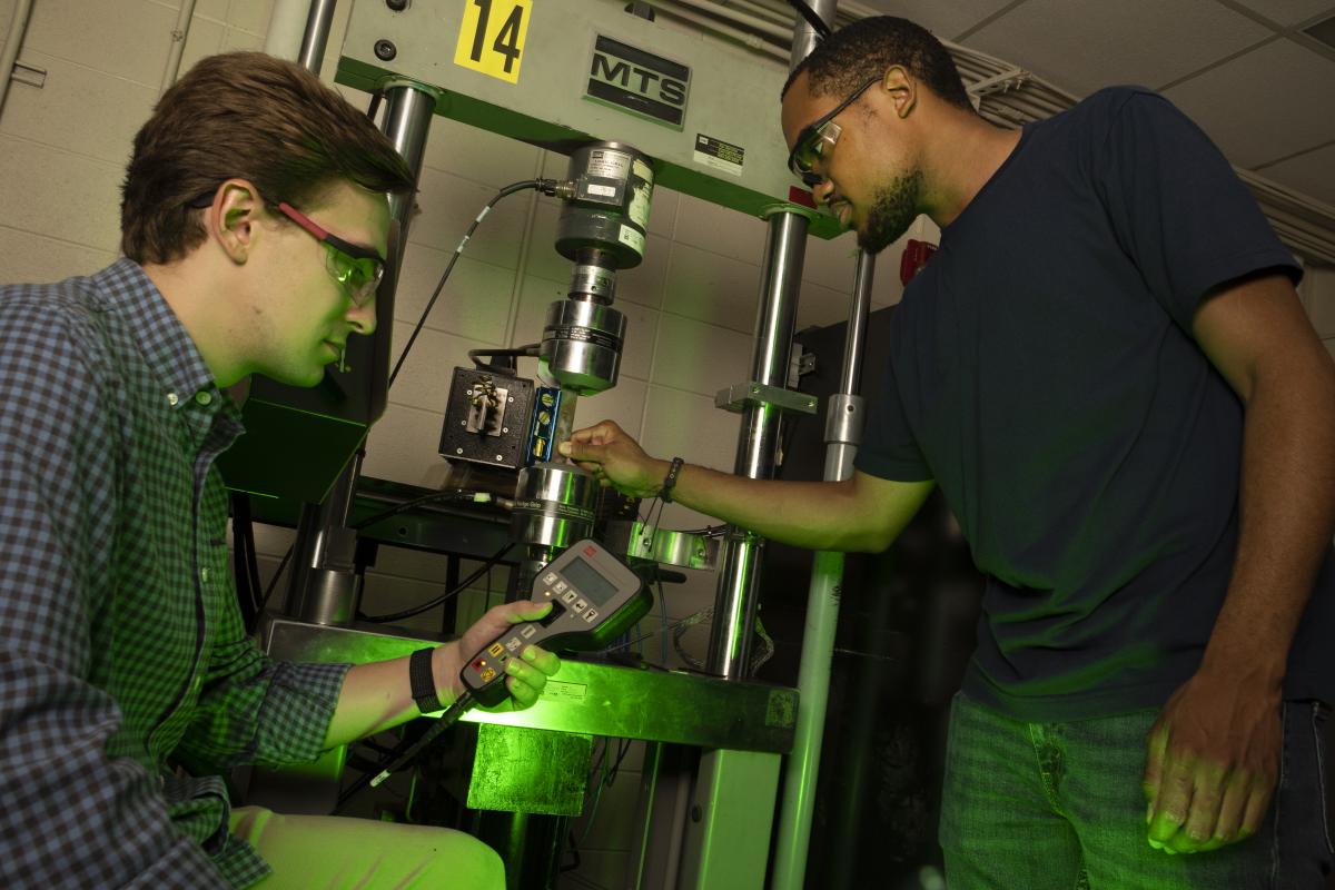 Grad student Alexander Caputo and SURE student Benjamin Pollard in the lab