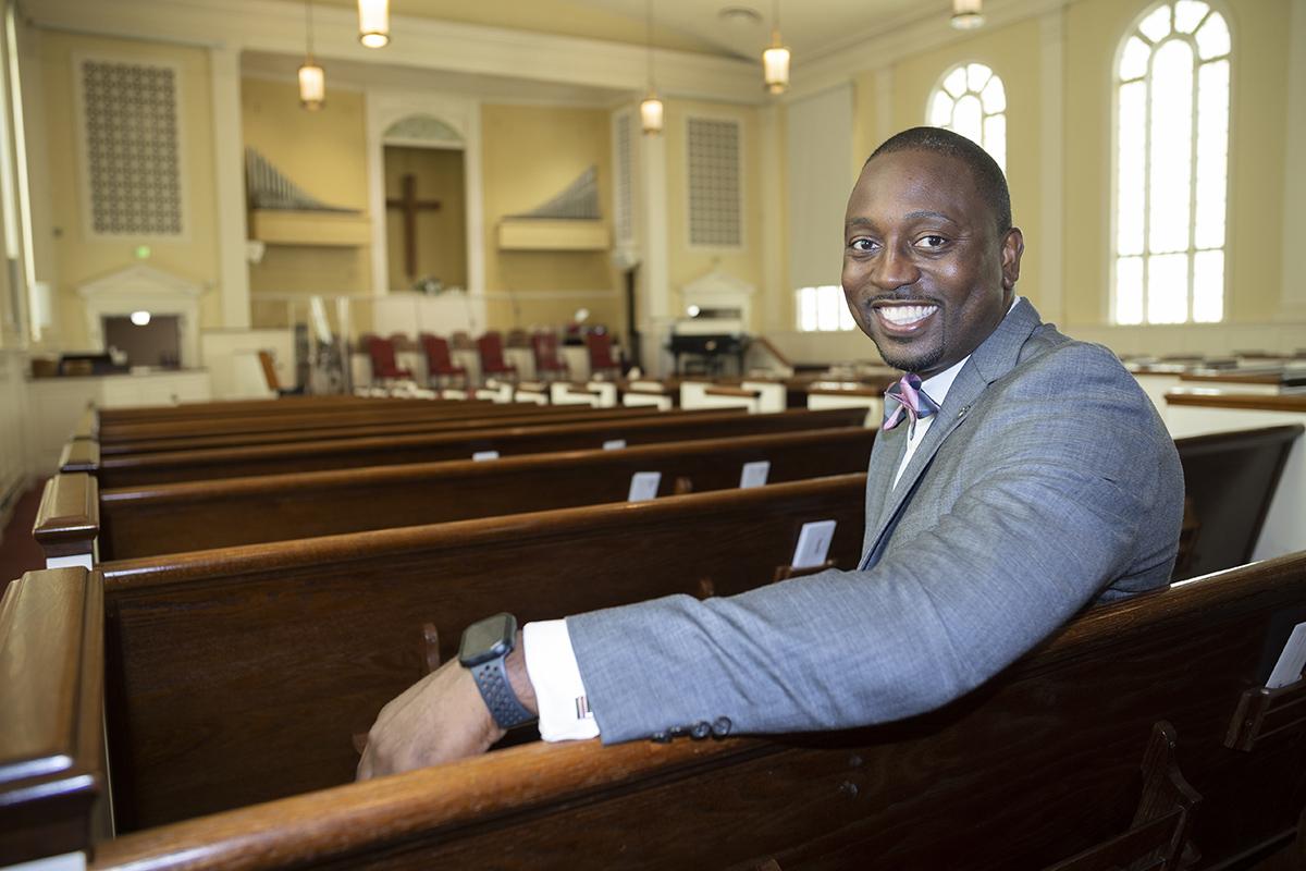 Damon P. Williams sits in a pew at Providence Missionary Baptist Church in southwest Atlanta, where he is senior pastor. (Photo: Candler Hobbs)
