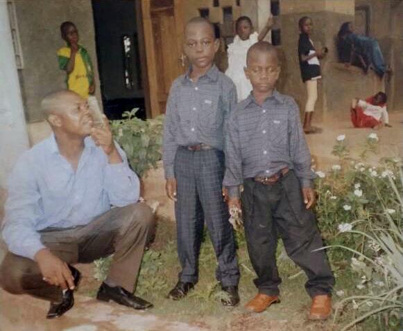Gideon Ndeh as a child with his father and brother in Cameroon