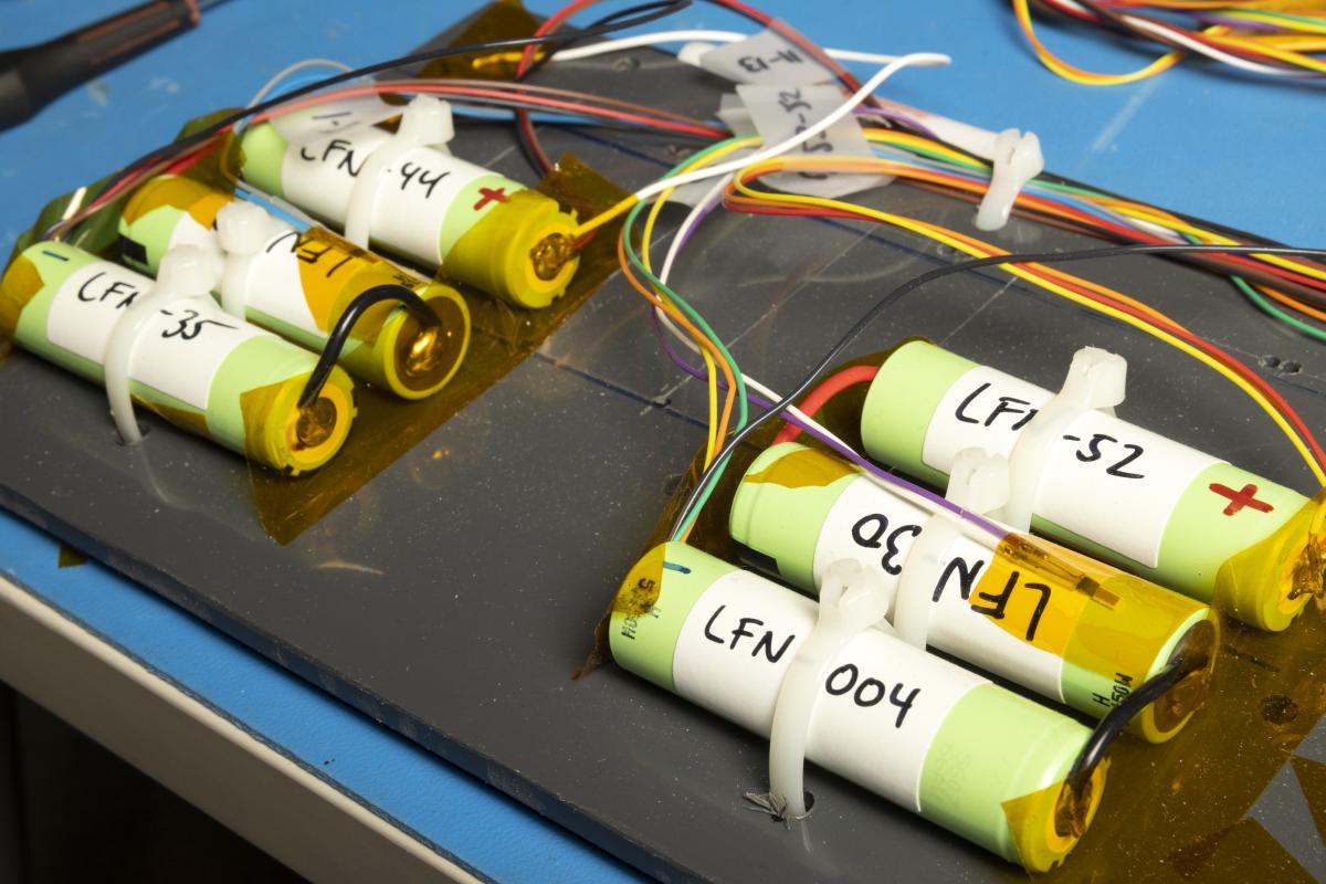 a closeup of the satellite's battery panel with six rechargeable batteries