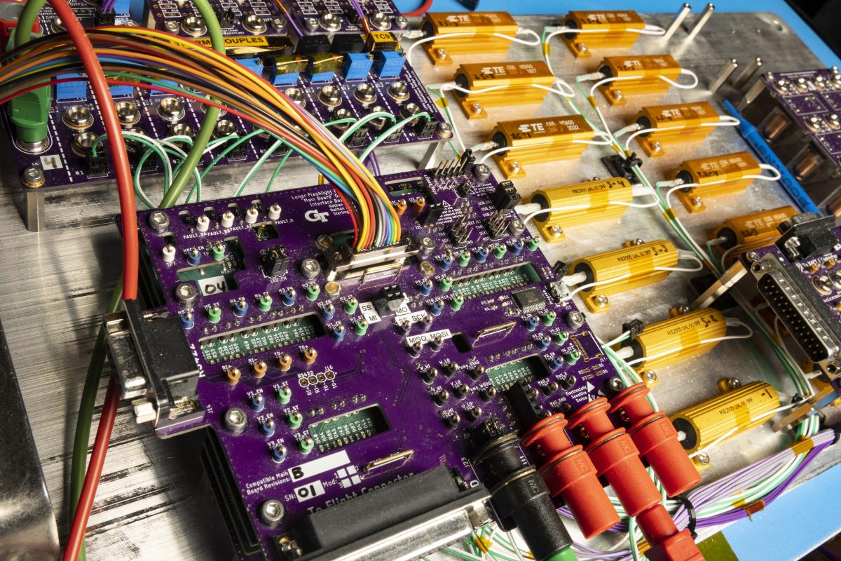 the satellite's propulsion system control - electrical components laid out on a board