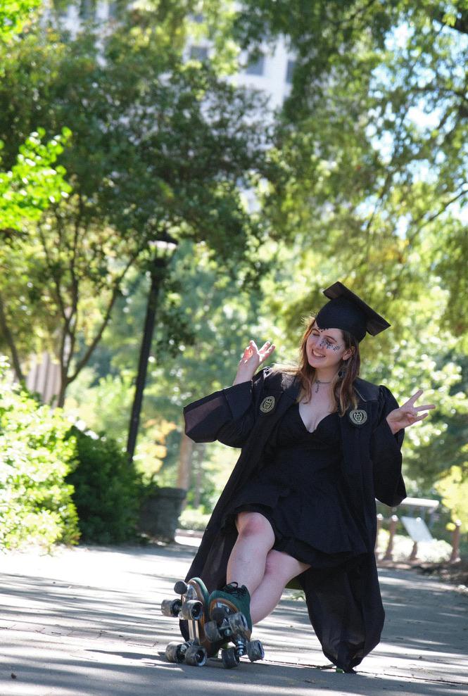 Simrill Smith in commencement regalia and roller skates