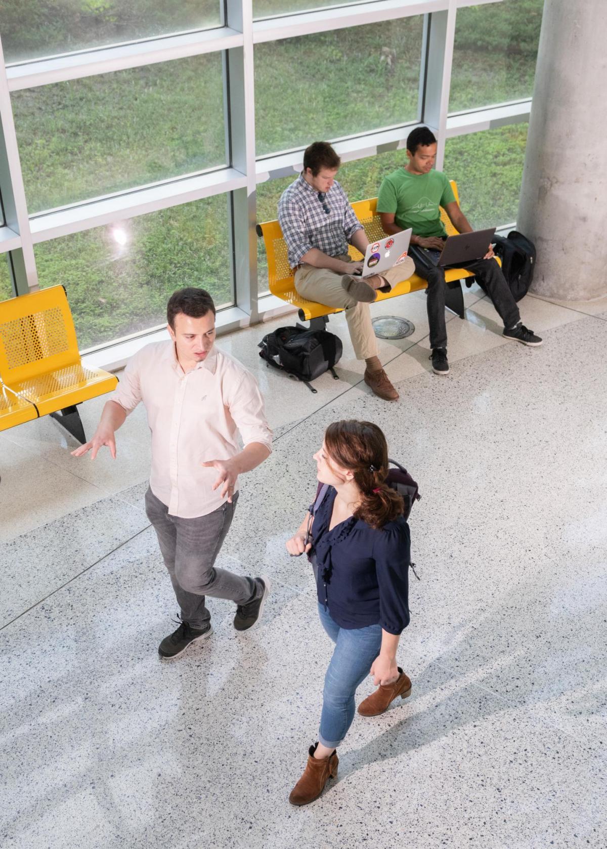 Students walking in an office