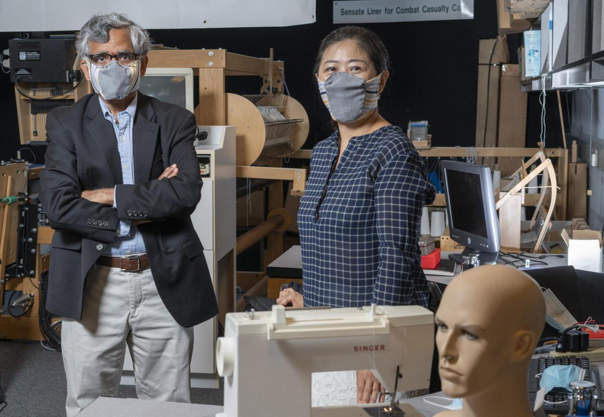 Sundaresan Jayaraman and Sungmee Park wearing masks in a lab space