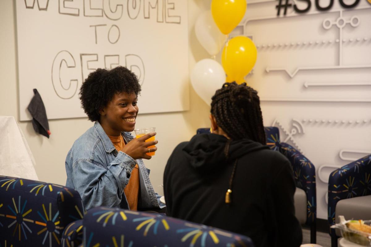 CEED students talking in the room's lounge area