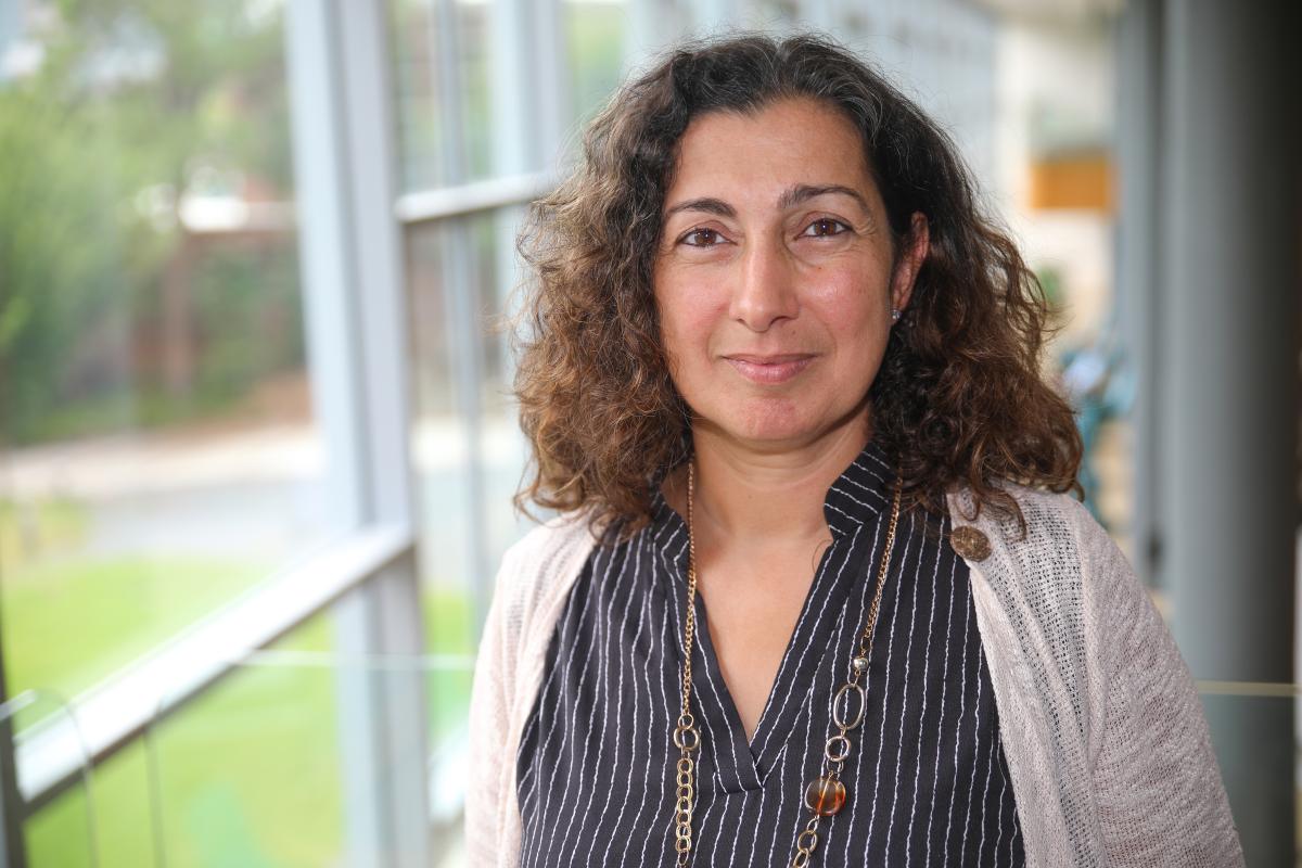 Kyriaki Kalaitzidou in front of windows