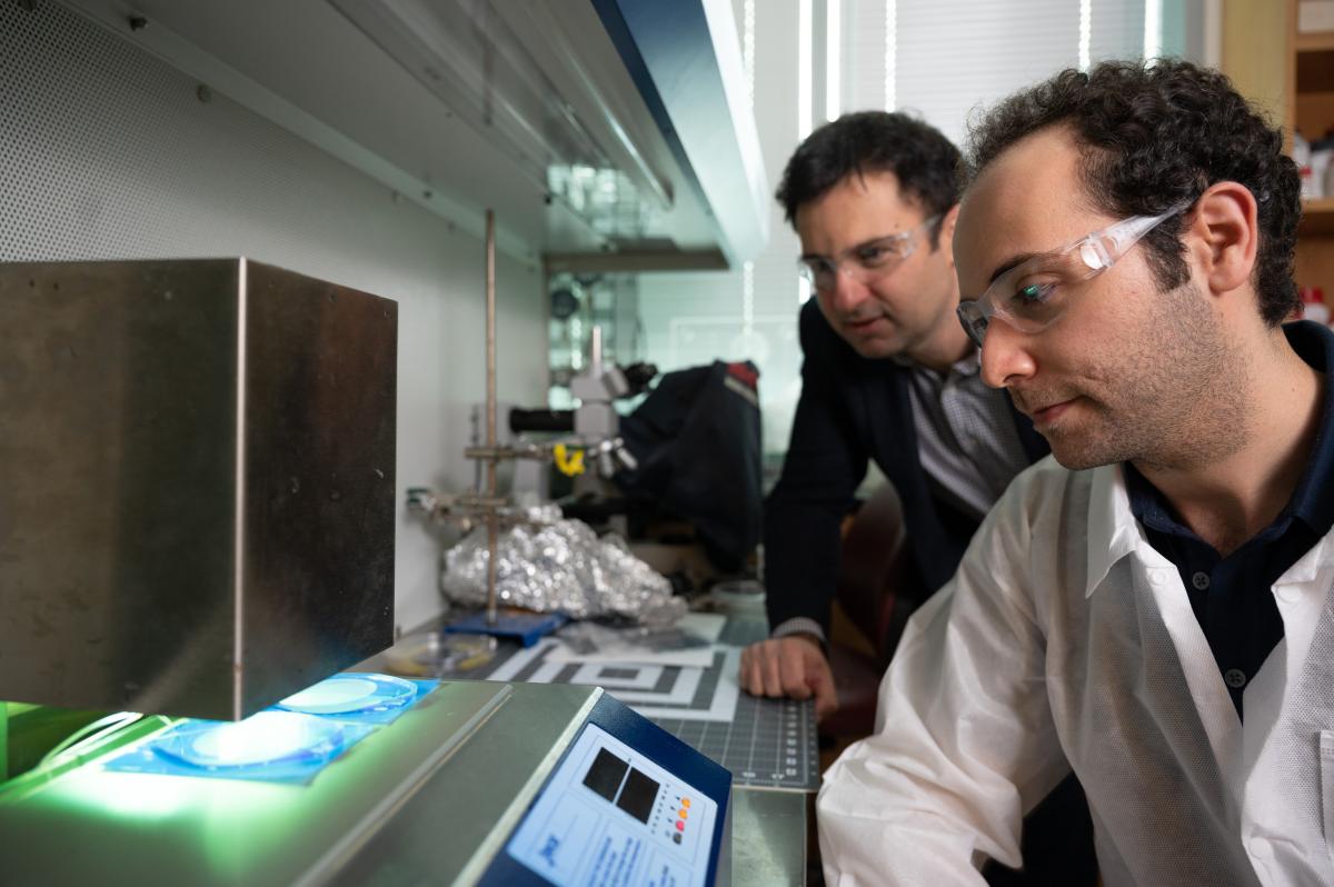 Fatih Sarioglu and grad student in the lab