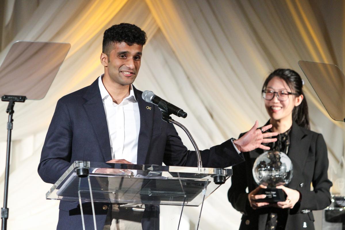 Vedant Pradeep and Ziyi Gao accept the Dean's Impact Award and make remarks