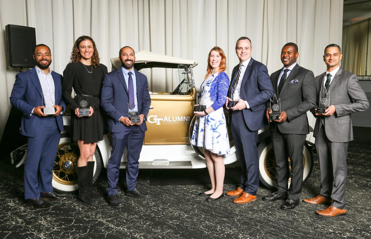 the group of young alumni inductees with the Ramblin' Wreck