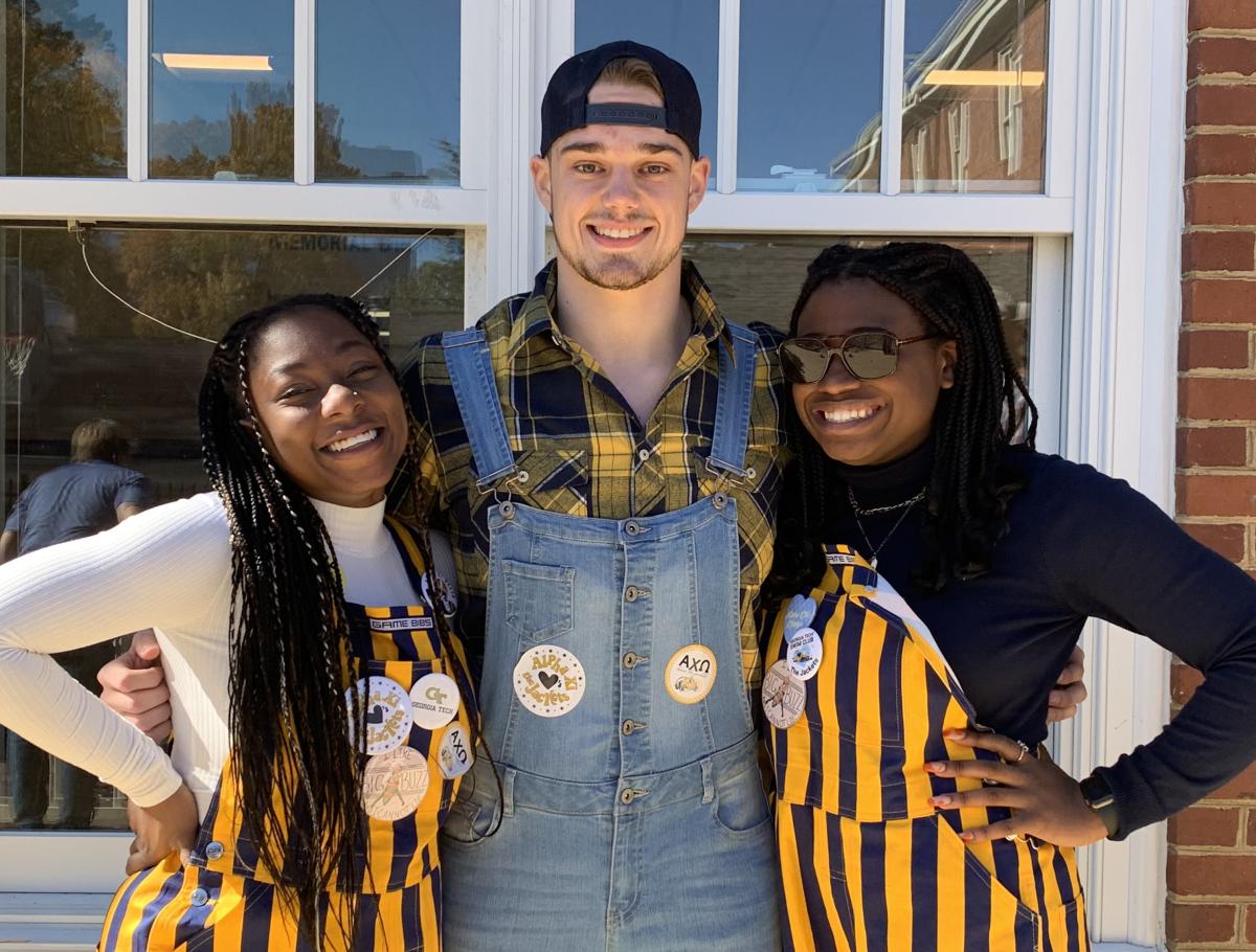 Fatima Sheriff with two other students pose at a Greek life event
