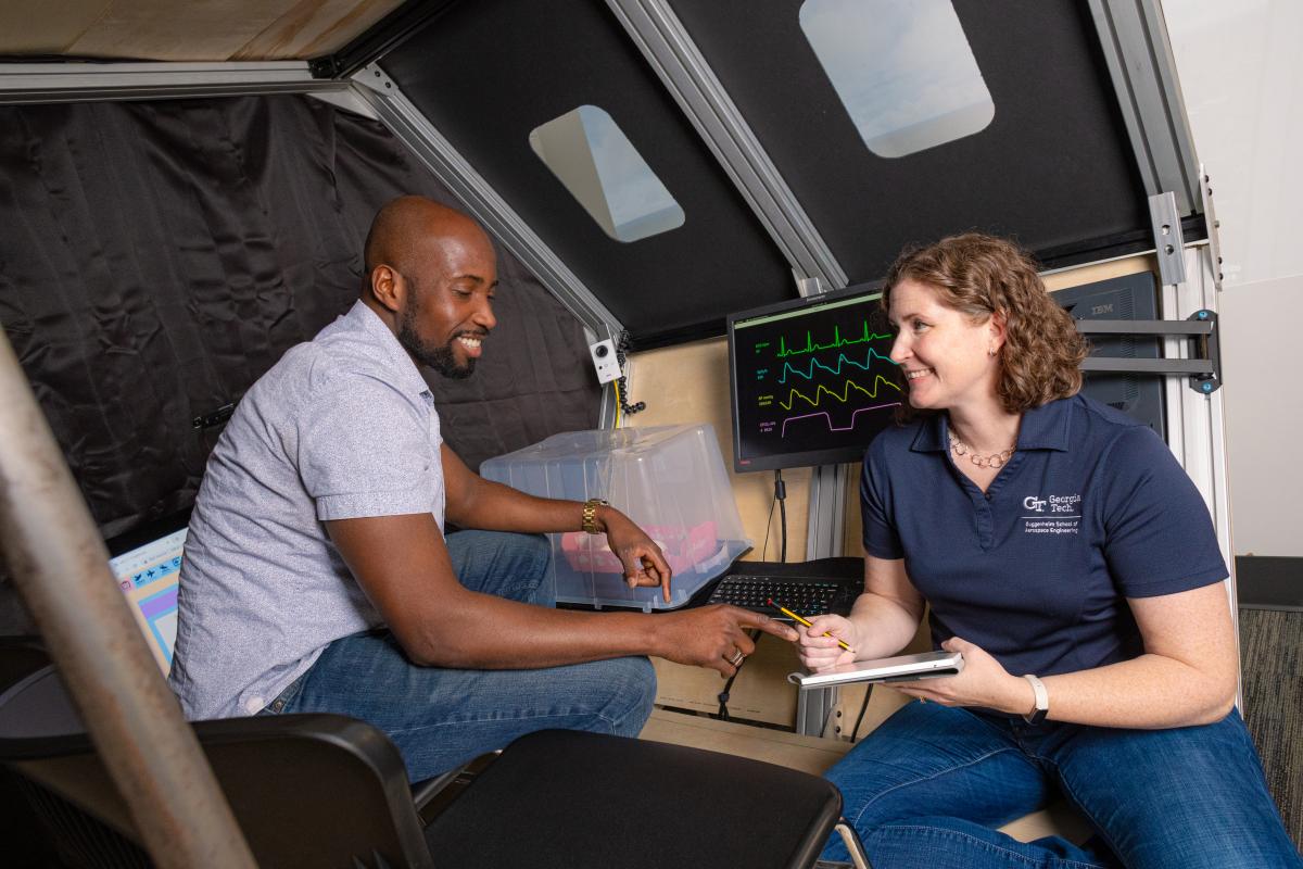 Karen Feigh and Ph.D. student Richard Agbeyibor conduct tests in the medevac simulator