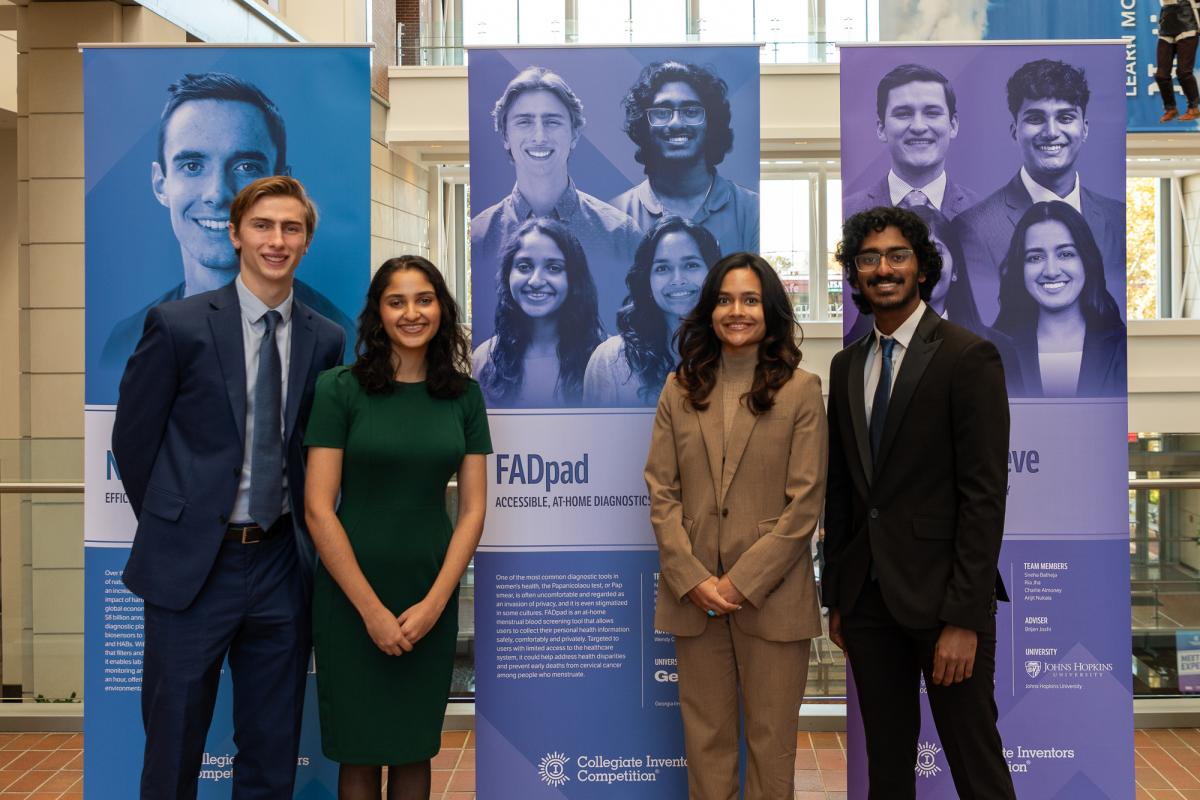 The FADpad team with their poster at the Collegiate Inventors Competition. From left, Ethan Damiani, Netra Gandhi, Rhea Prem, and Girish Hari. (Photo Courtesy: National Inventors Hall of Fame)