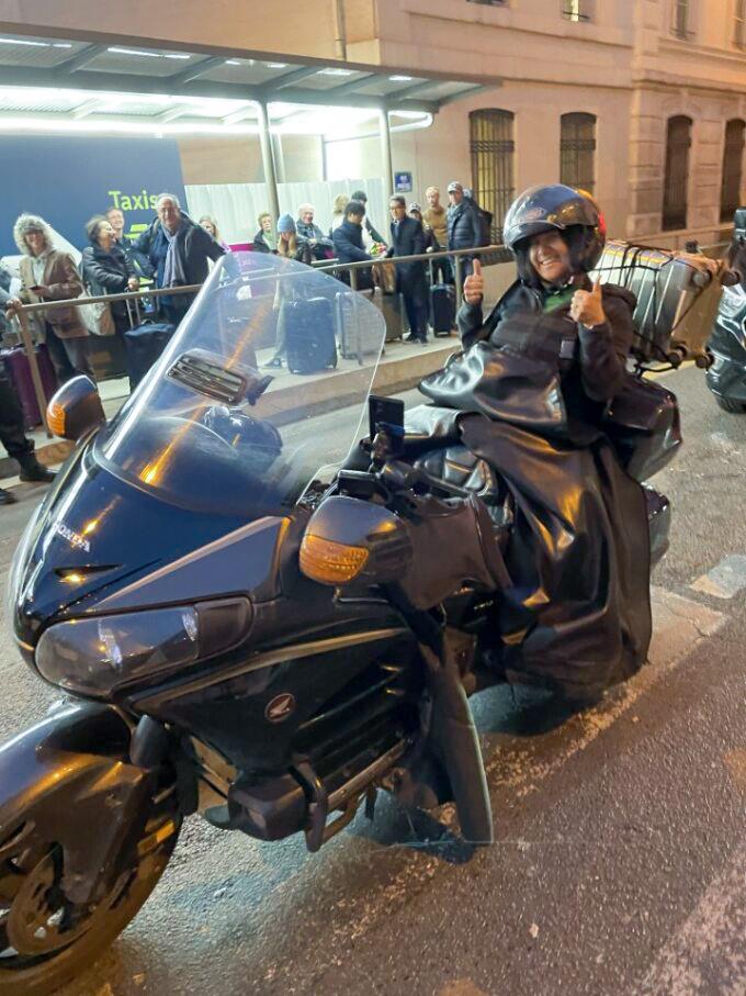 Parika “Pinky” Petaipimol on the back of a motorcycle in Paris, France.