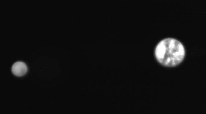 A black and white photo of Earth and the moon