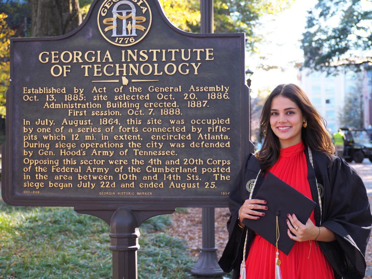 Nicole Proudfoot stands by the Georgia Tech historical marker