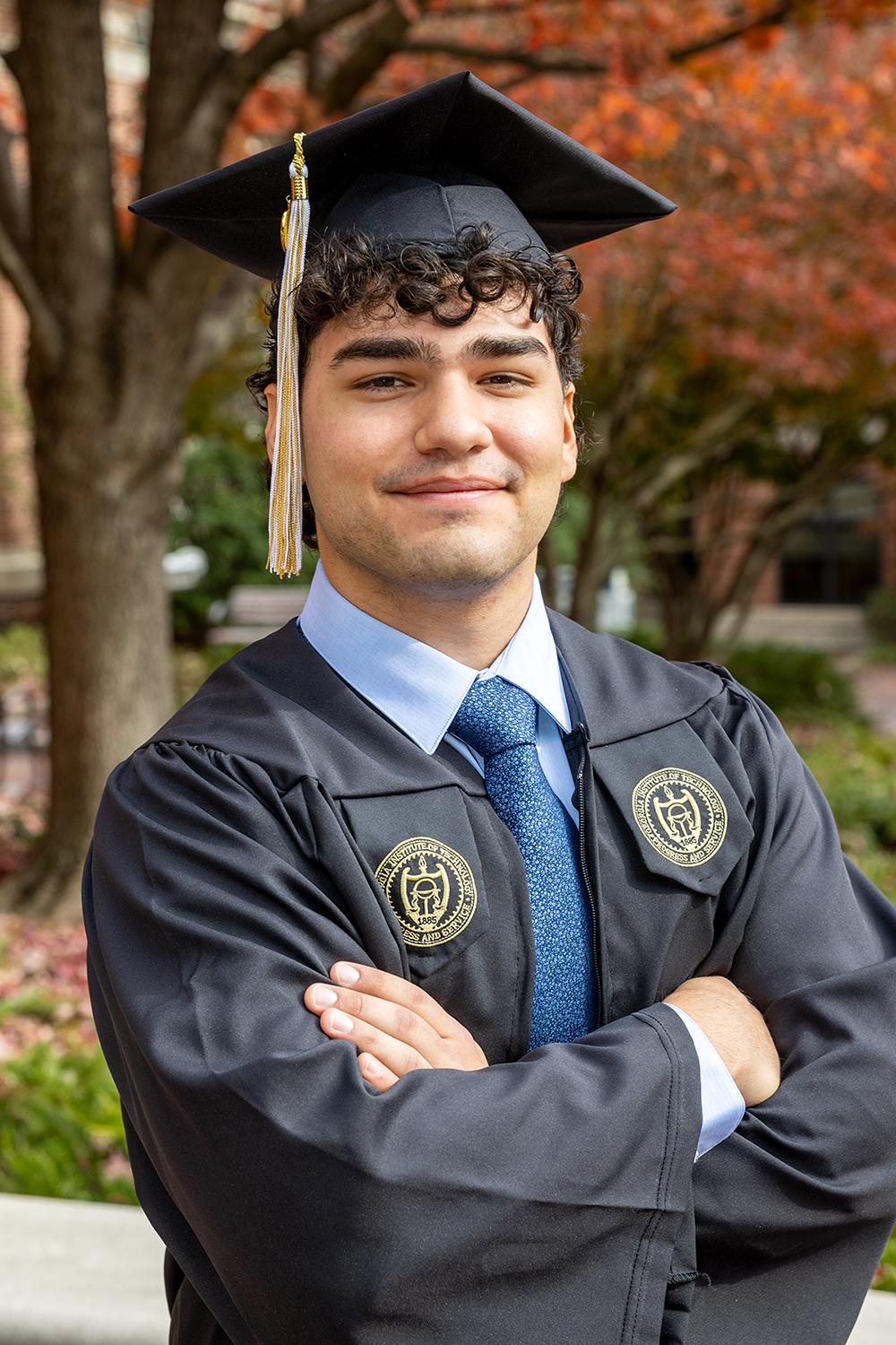 Kian Zarbaf in graduation regalia