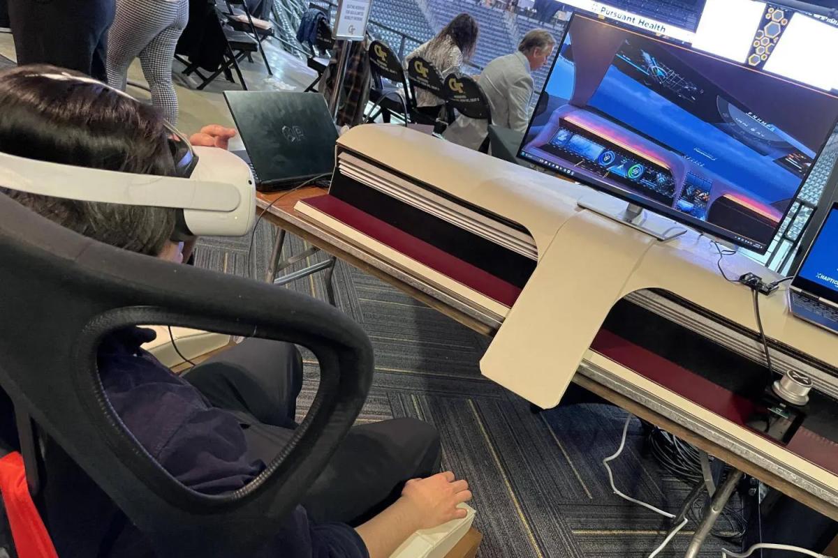 student in VR driving simulator