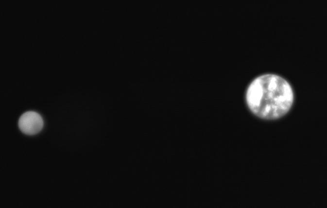 A black and white photo of Earth and the moon