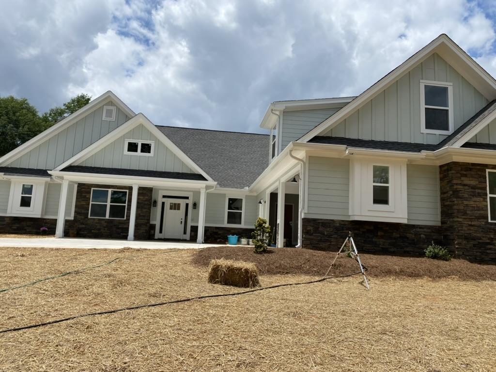 a newly built house with strawed yard