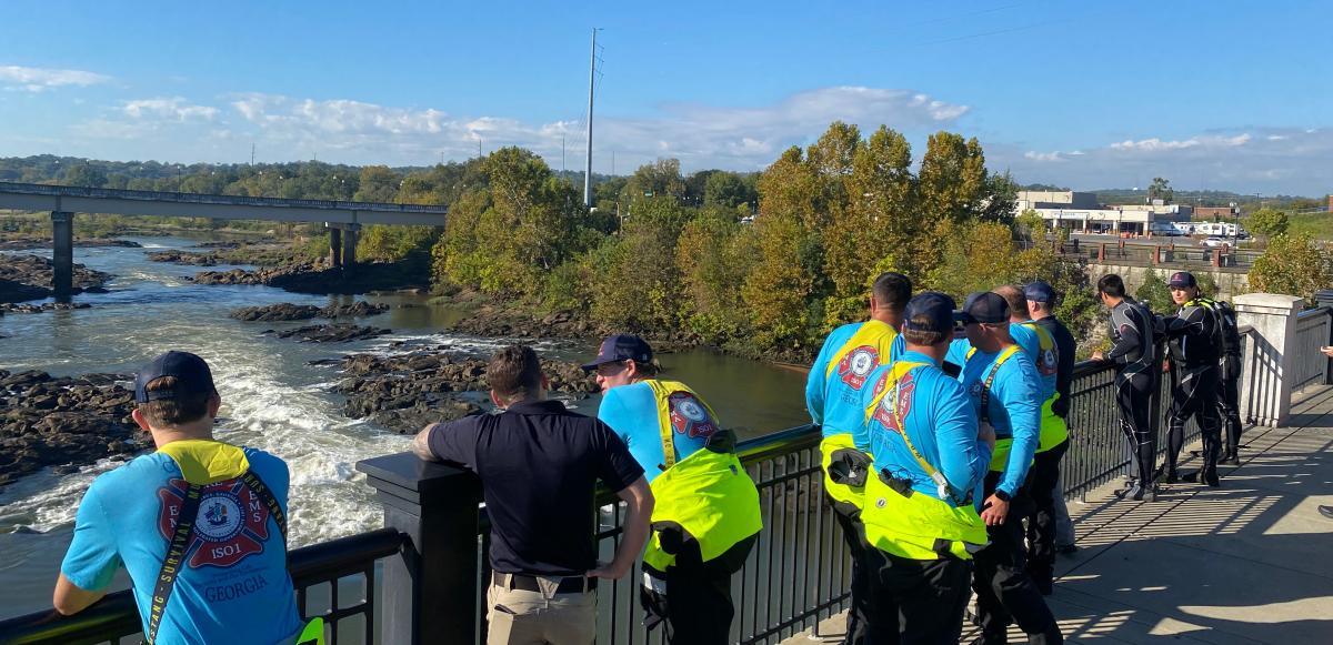 Emergency personnel look over rapids in the Chattahoochee River