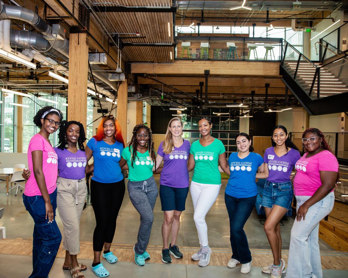 group of adults wearing STEM Gems shirts