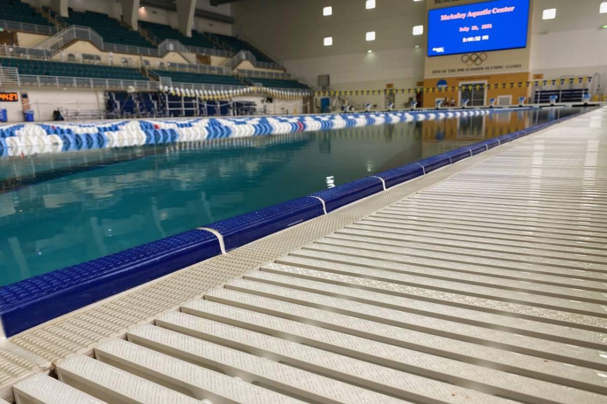 a closeup of the poolside gutter system at McAuley Aquatic Center