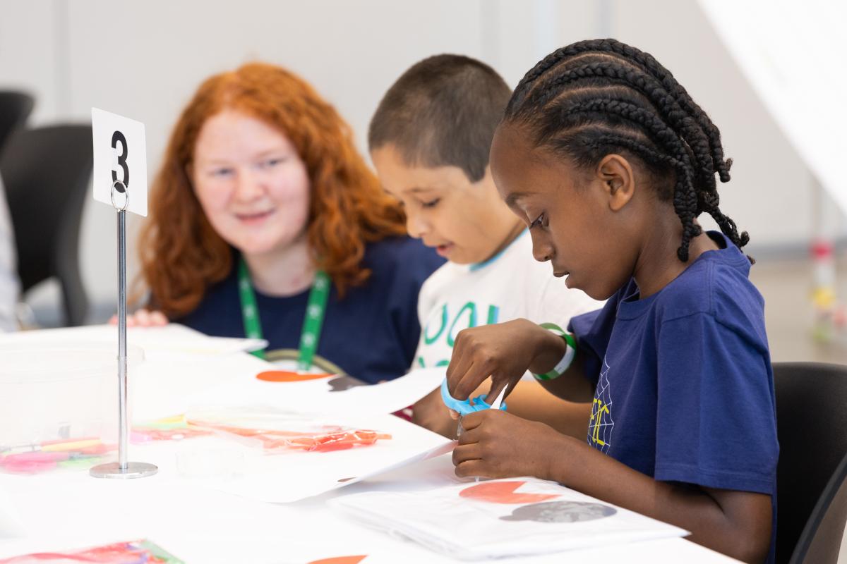 kids at a table creating stuff at STEM Fest 